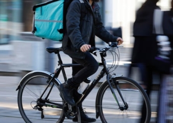 Food delivery riders call on platforms to open up AI ‘black box’ they say has cut pay