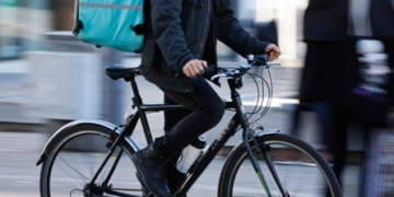 Food delivery riders call on platforms to open up AI ‘black box’ they say has cut pay